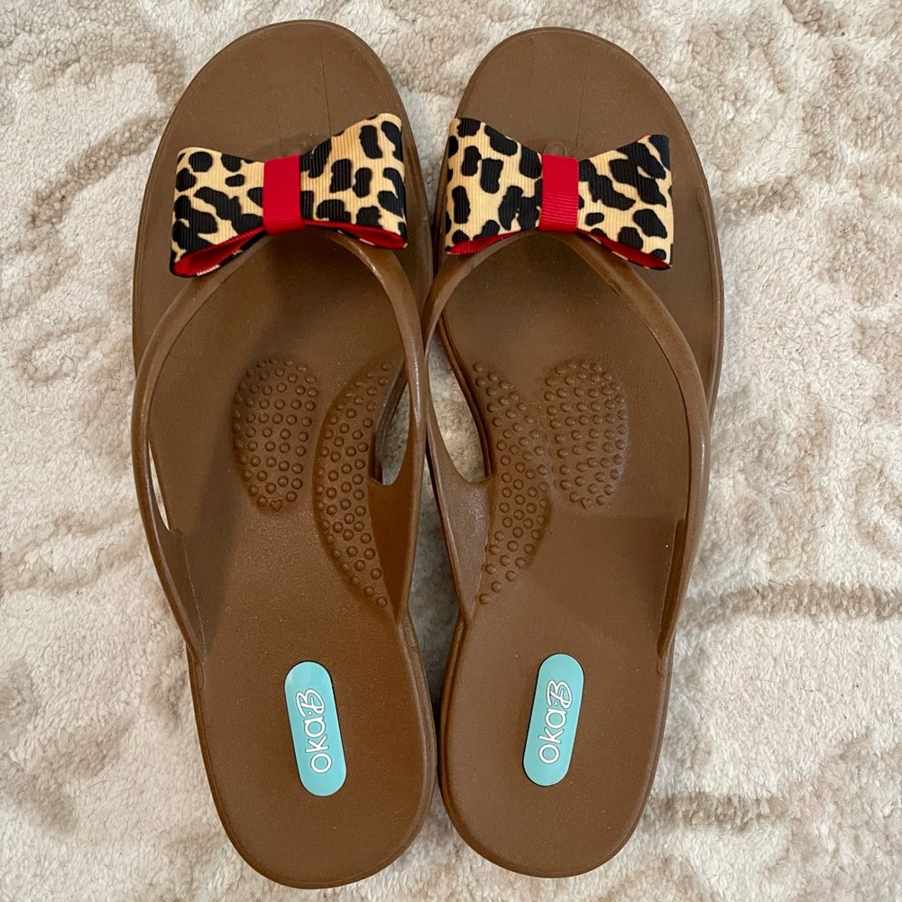 Oka B rubber flip flop sandals.